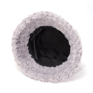 Detailed interior of plush bucket hat showing warm black lining and adjustable drawstring