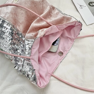Detail view of pink velvet tote with silver sequins, magnetic closure and inner pocket