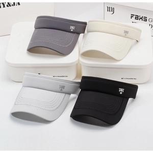 Detail of four quick-dry sun visors in grey, beige and black with metallic logo