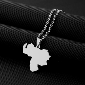 Detailed close-up of a silver stainless steel Venezuela map pendant on an O-chain link