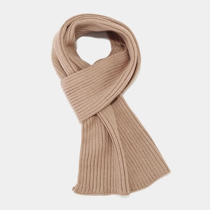 Close-up of khaki ribbed knit scarf showing soft texture and premium winter material