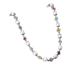 Elegant pearl necklace featuring colorful gemstone flower pendants on a white background