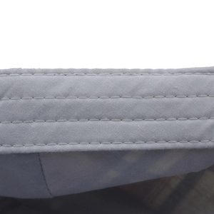 Detail shot of grey cotton plaid beret cap showing high-quality parallel stitching lines
