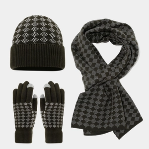Detailed knit texture of winter hat scarf and touchscreen gloves with diamond pattern