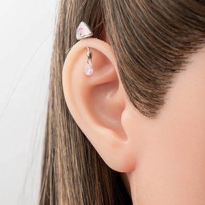 Surgical steel cat ear piercing stud with pink gemstone teardrop pendant on model