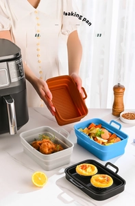 Detail view of rectangular silicone air fryer liners with oil drainage and dual handles
