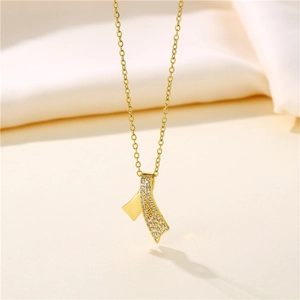Minimalist gold stainless steel crossover necklace with ribbon pendant and cubic zirconia