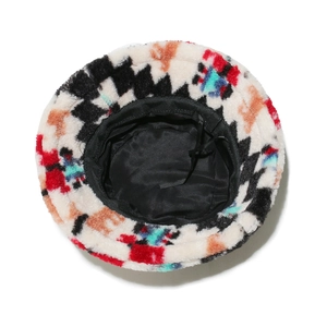 Detail view of winter plush bucket hat showing geometric patterns and internal drawstrings