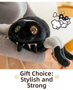 Close-up of a cute black plush spider toy with large colorful eyes and soft fuzzy texture
