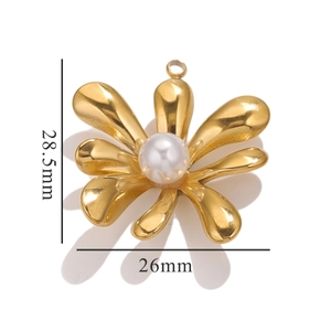 Macro view of gold flower pendant with pearl and 28.5mm by 26mm size measurements