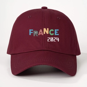 Close-up of a burgundy France 2024 baseball cap featuring colorful striped typography