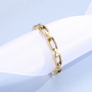 Polished gold geometric link ring in minimalist chain design on white silk background