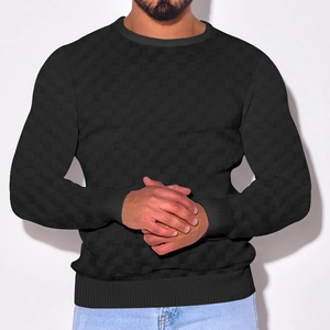 Close-up of premium checkered knit texture on men's black long sleeve sweater