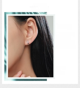 Close-up of S925 sterling silver hoop earring featuring three sparkling zircon stones