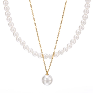French vintage stainless steel layered necklace with white pearls on a white background