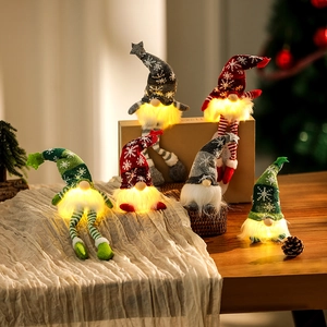 Lighted Christmas gnomes with knitted hats and warm LED lights for holiday home decor