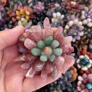 Close-up of handmade natural rose quartz and citrine tumbled stone flower ornament