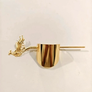 Detailed view of a golden metal hair slide with an elegant phoenix-engraved hairpin stick