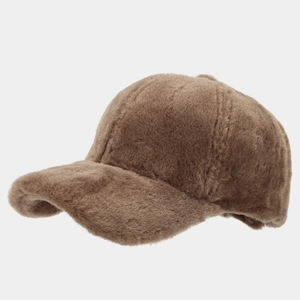 Close-up of deep brown faux fur plush baseball cap showing thick winter warmth texture