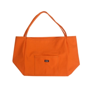 Minimalist orange canvas tote bag with UNSP label and front pocket on white background