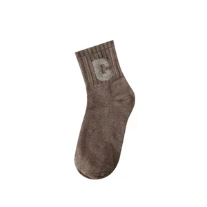 Detailed view of brown cotton mid-calf sock with ribbed cuff and grey letter C logo