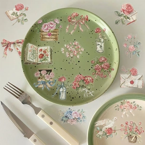 Detailed view of vintage flower and letter PET stickers on decorative tableware