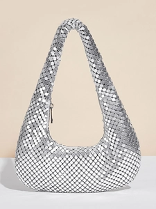 Close-up of silver sequin hobo bag showing metallic texture and smooth zipper detail