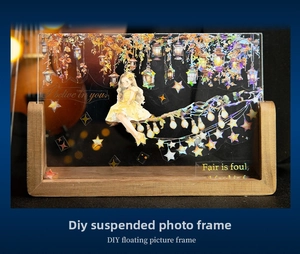 Close-up of DIY floating picture frame with wooden base and anime lantern decorative stickers