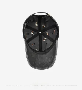 Detailed interior of washed denim baseball cap featuring colorful athlete embroidery