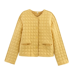 Women's bright yellow quilted jacket with round neck and diamond stitching on white background