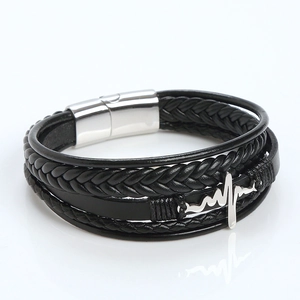 Detail of multi-layer black leather bracelet with silver magnetic clasp and heart rate pattern
