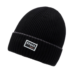 Classic black rib-knit beanie with turn-up cuff and fashion label for outdoor warmth