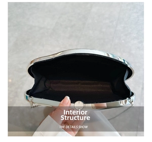 Internal structure of the silver metal evening clutch with black fabric lining and chain