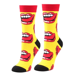 Detail of yellow cotton mid-calf socks with red lips pattern and red ribbed cuffs