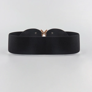 Detail shot of black elastic wide waist belt featuring a gold sunflower alloy buckle