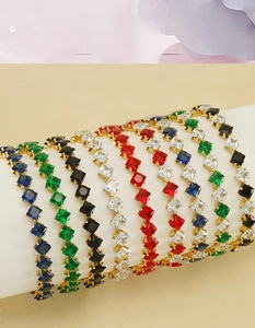Detail of 18k gold plated stainless steel bracelets with multicolored zircon stones