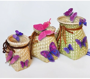 Detailed view of handmade woven bamboo baskets adorned with realistic 3D butterfly stickers