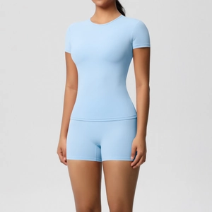 Slim fit light blue yoga set with short sleeve t-shirt and high waist compression shorts