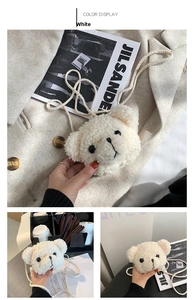 Detail showing plush cream-colored teddy bear face crossbody bag with soft faux fur texture