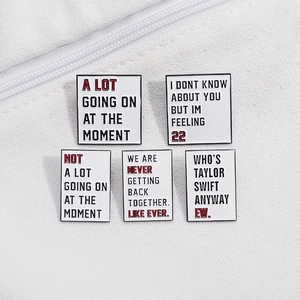 Set of 5 geometric speech bubble enamel pins featuring iconic creative song lyric designs