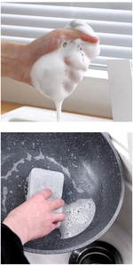 Macro view of grey cleaning sponge creating rich white foam while washing a pan
