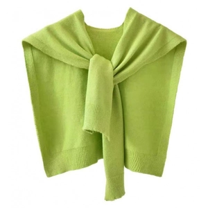 Macro view of bright lime green knit shawl with fine stitch texture and ribbed edge
