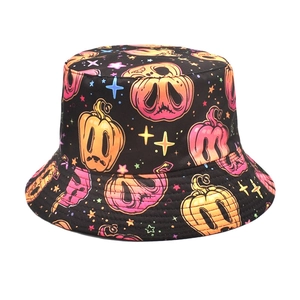 Close-up of vibrant gradient pumpkin patterns on a black Halloween bucket hat