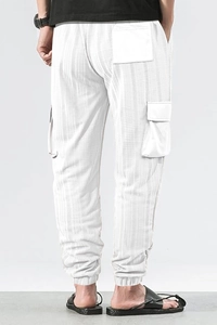 Detailed back view of white waffle textured cargo pants with drawstring and pockets