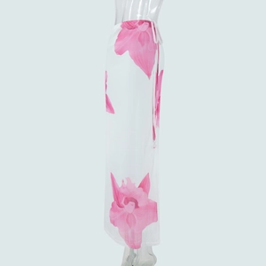 Detail view of tropical pink floral print mesh skirt with side tie ribbon design