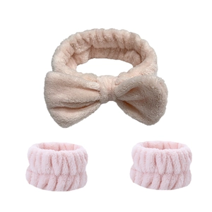 Close-up of soft pink microfiber headband with bow and matching wrist washbands