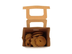 Close-up of brown kraft paper gift box with handle filled with assorted cookies