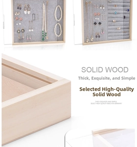 Detail of solid wood jewelry organizer with gray velvet lining and clear dustproof cover