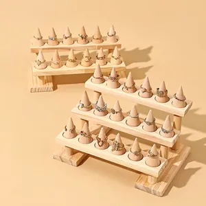 Multi-tier solid wood ring display stand with conical holders for jewelry showcasing
