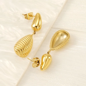 Golden teardrop earrings with elegant spiral textured pendants and metallic butterfly back
